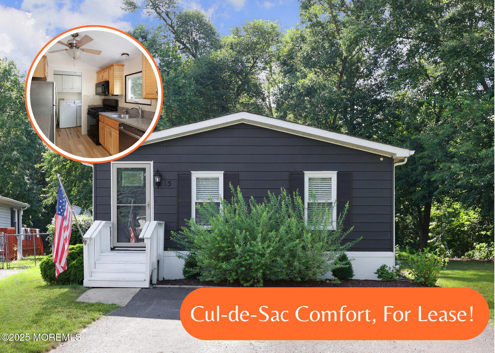 a front view of house with a garden