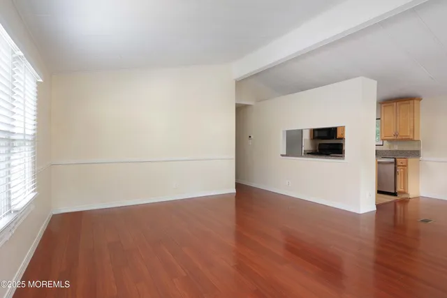 a view of a livingroom with wooden floor