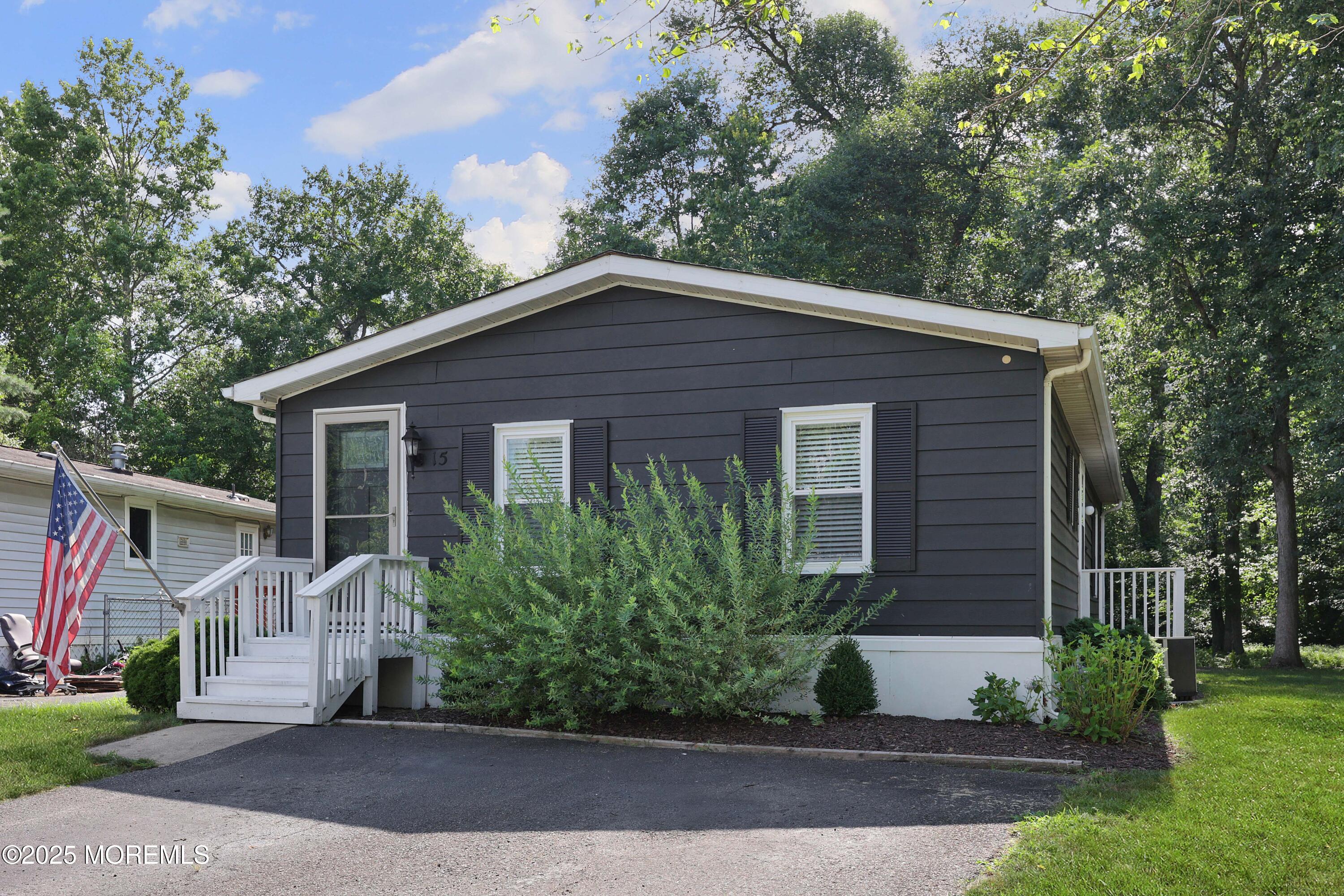15 Cedar Court Manalapan, NJ 07726 - Photo 2 of 30 a front view of a house with a yard