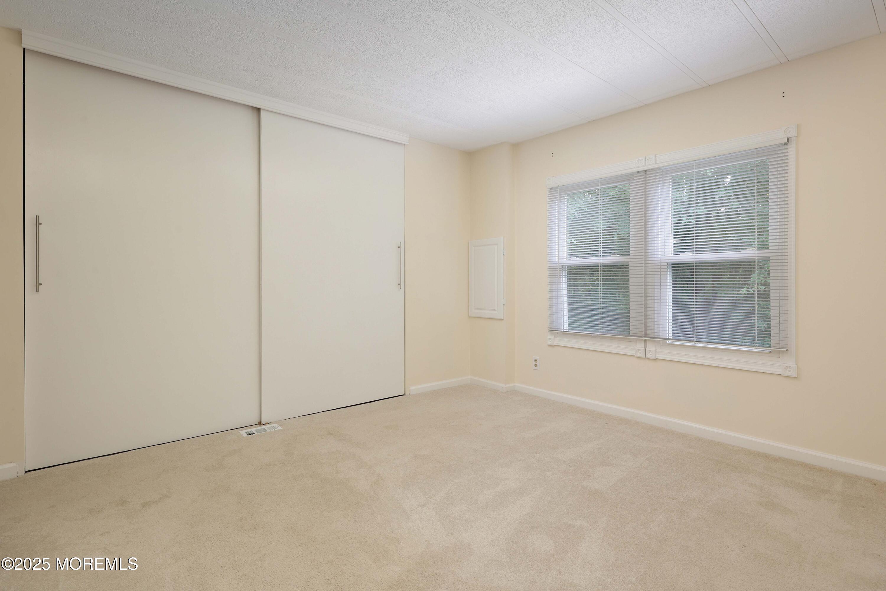 15 Cedar Court Manalapan, NJ 07726 - Photo 27 of 30 a view of an empty room with a window