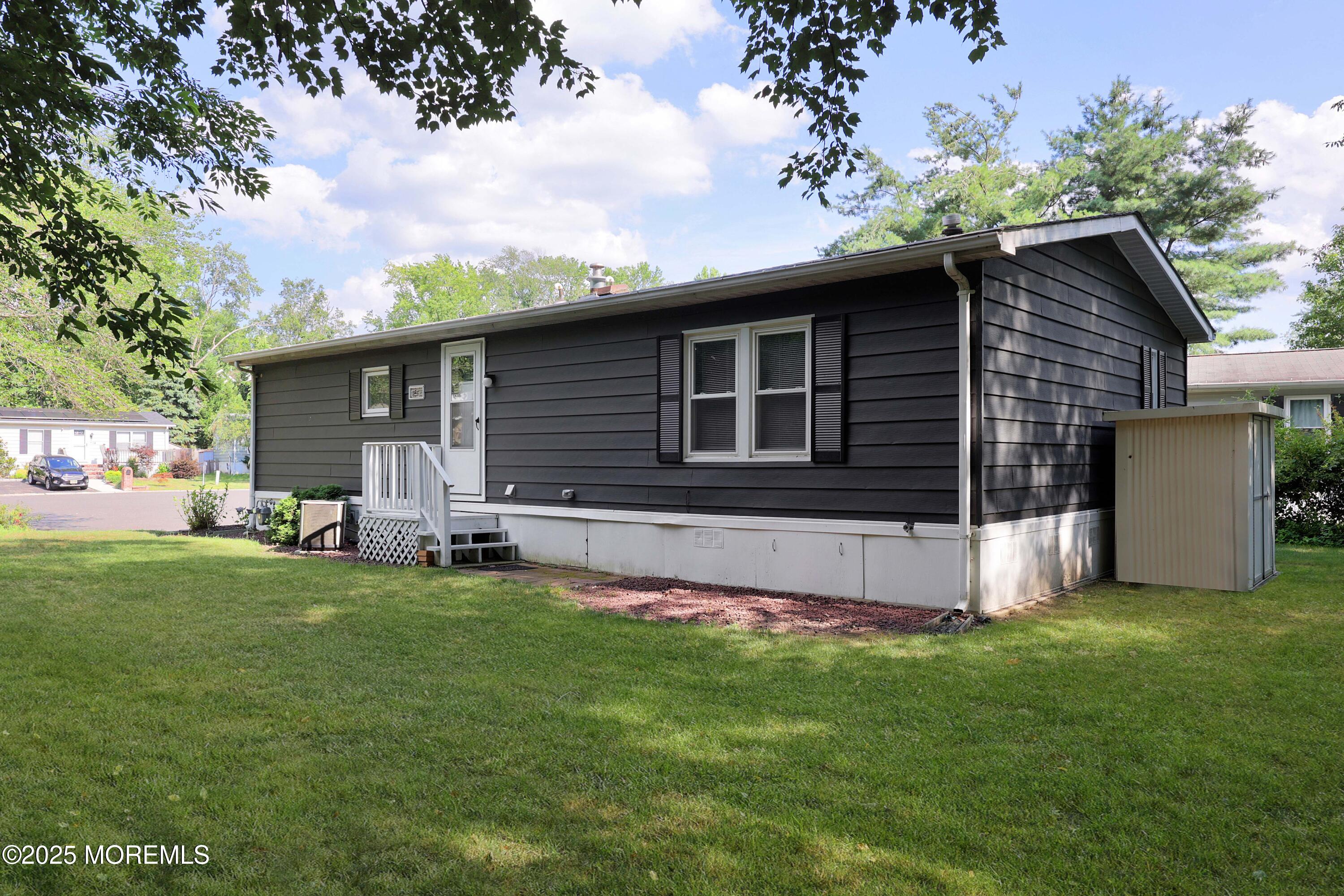 15 Cedar Court Manalapan, NJ 07726 - Photo 6 of 30 a house with garden in front of it