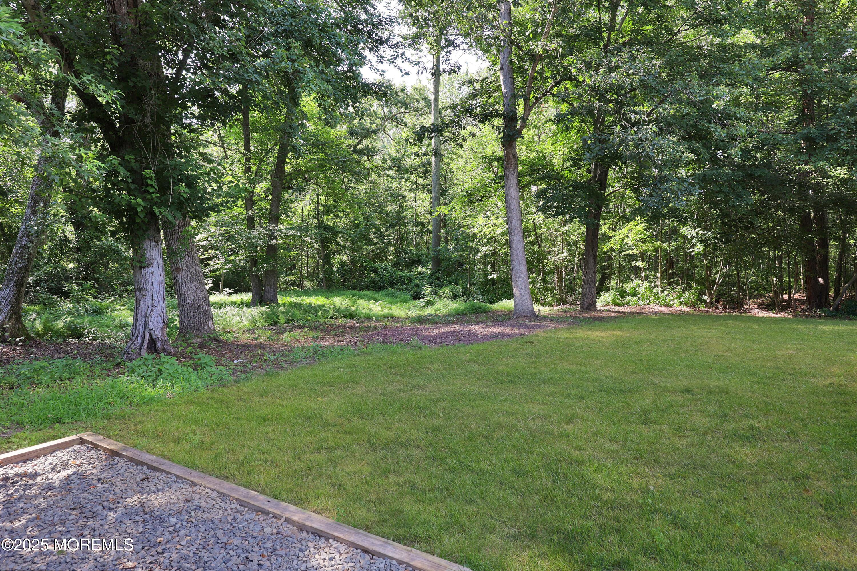 15 Cedar Court Manalapan, NJ 07726 - Photo 9 of 30 a view of outdoor space with deck and yard