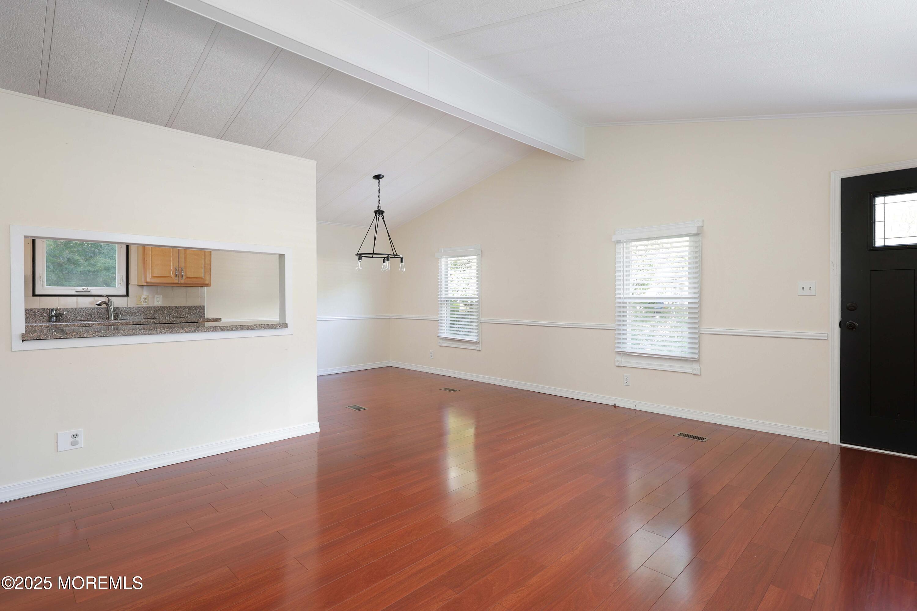 15 Cedar Court Manalapan, NJ 07726 - Photo 10 of 30 a view of wooden floor and windows in a room
