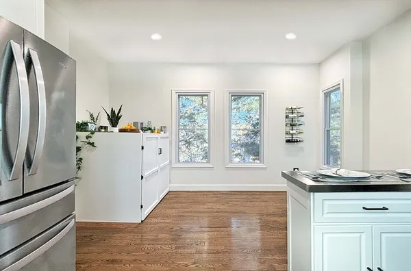 a kitchen with stainless steel appliances a refrigerator sink and cabinets