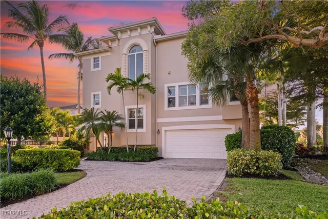 a view of a hallway to a livingroom with a potted plant