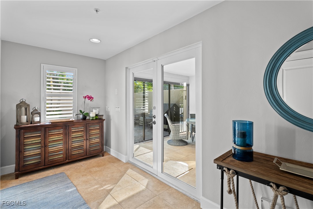 1104 6th Street South, Unit 1 Naples, FL 34102 - Photo 4 of 47 a view of a livingroom with furniture and windows