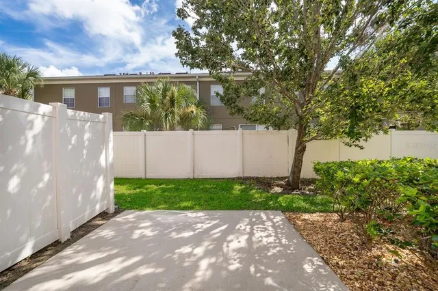 a backyard of a house with lots of green space