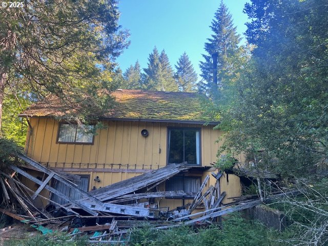 1890 Upper Camas Road Camas Valley, OR 97416 - Photo 1 of 9 a backyard of a house with table and chairs