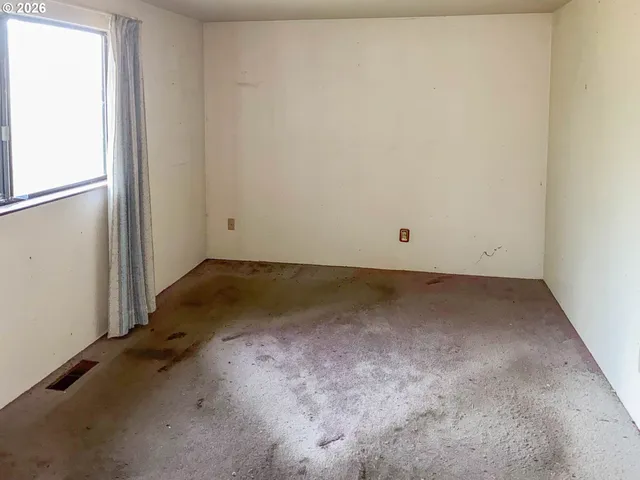 an empty room with a bench