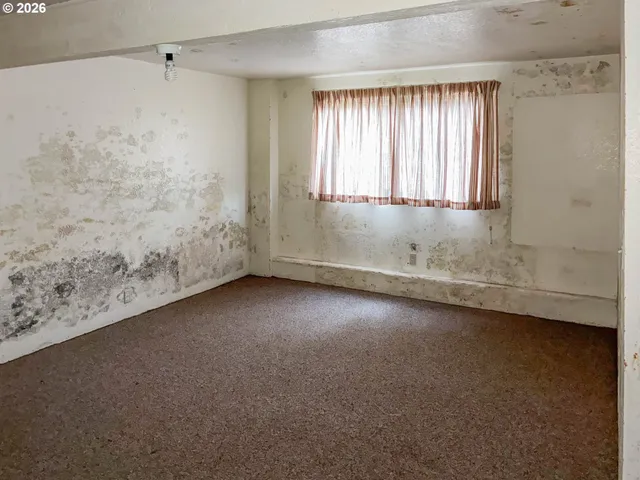 a view of a room that has a window in it