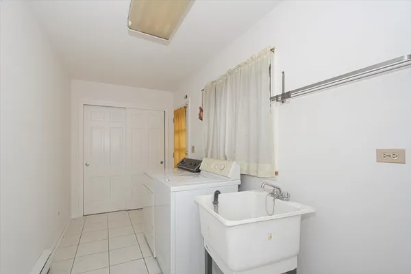 a bathroom with a sink a toilet and tub