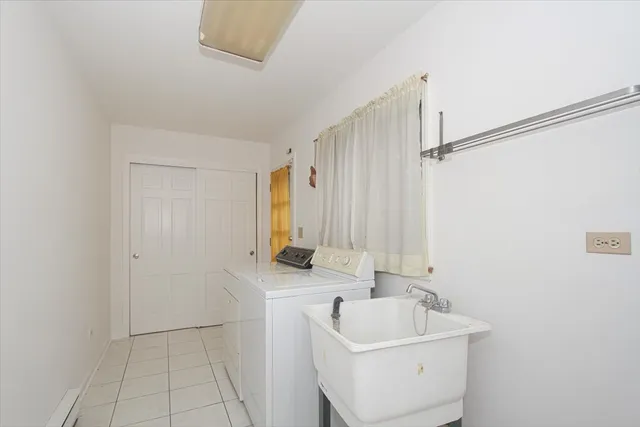 a bathroom with a sink a toilet and tub