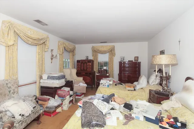 a bed room with furniture and a lamp