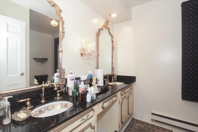 a bathroom with a sink double vanity and a mirror