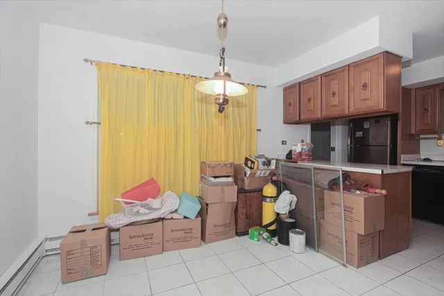 a kitchen that has a lot of cabinets in it