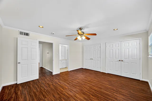 a bathroom with a granite countertop sink toilet a mirror and shower