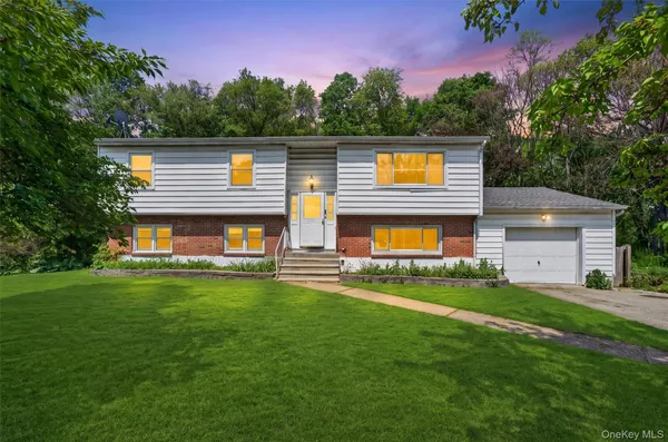 a view of a house with a back yard