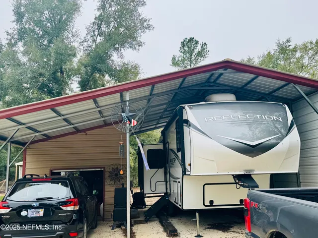 a view of a yard with trees