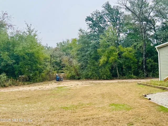 a view of a swimming pool with an outdoor space