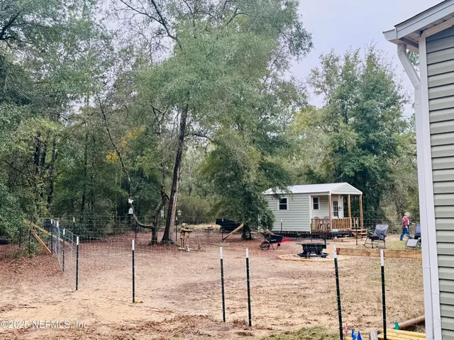 a view of backyard with green space