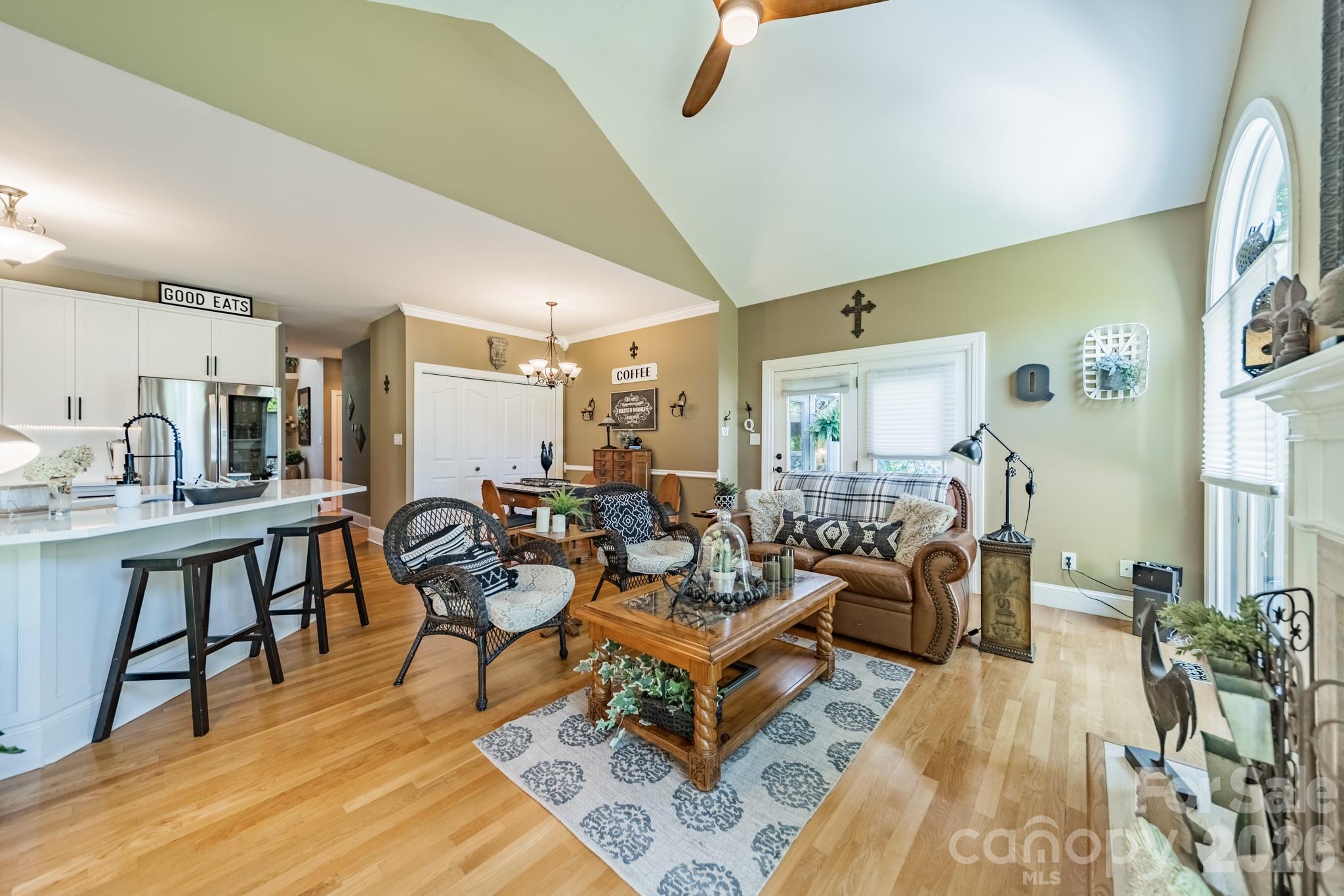 11043 Seven Coves Drive Tega Cay, SC 29708 - Photo 23 of 45 a living room with lots of furniture and paintings on the wall