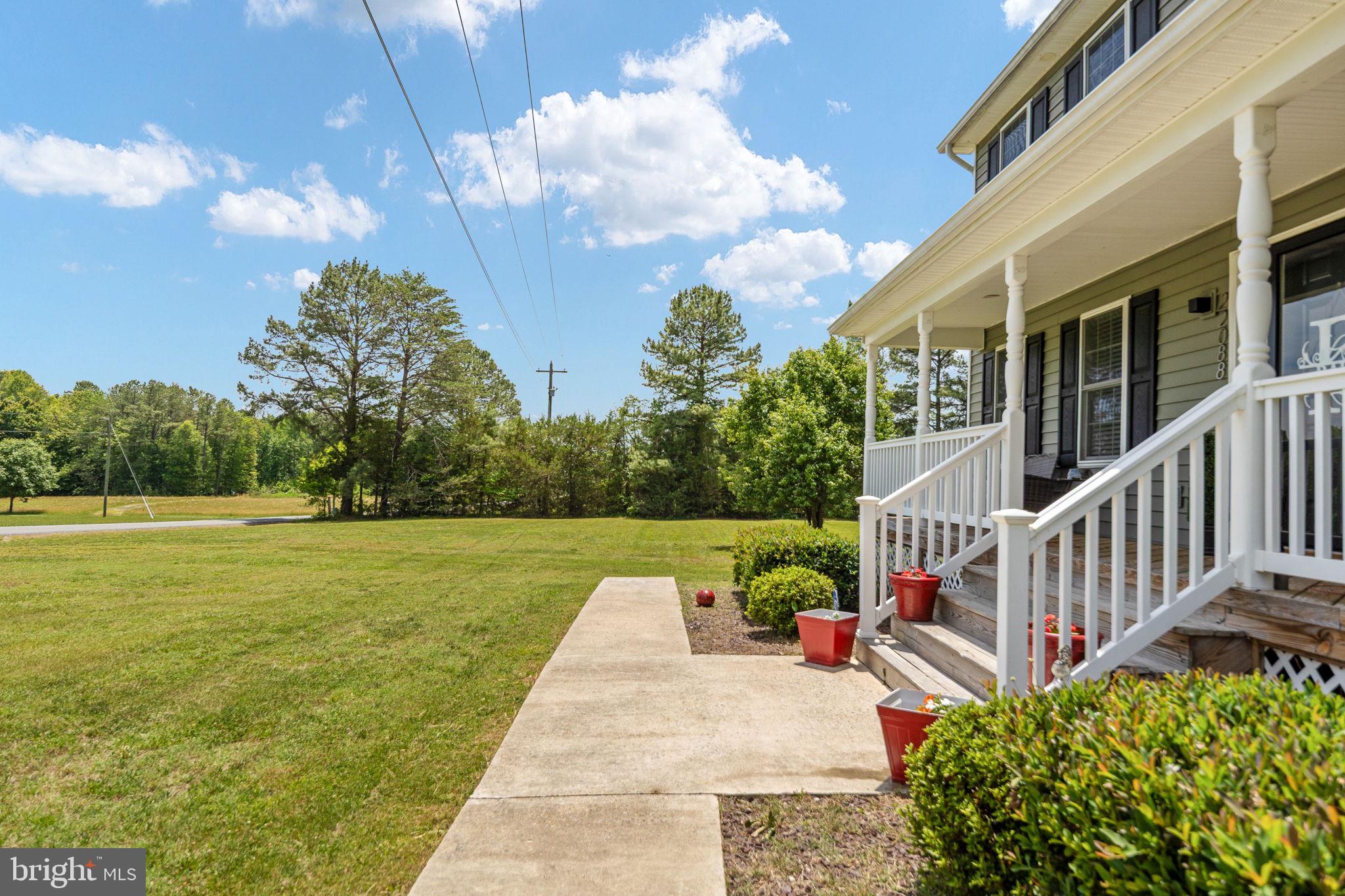 22088 Landora Bridge Road Ruther Glen, VA 22546 - Photo 20 of 122 Charming porch with lush green views.