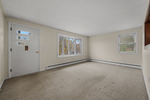 a kitchen with stainless steel appliances granite countertop a refrigerator a sink dishwasher a stove with cabinets and wooden floor