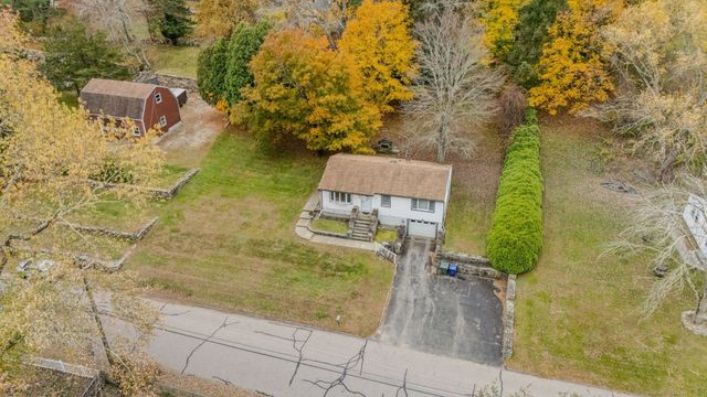 a aerial view of a house with a yard