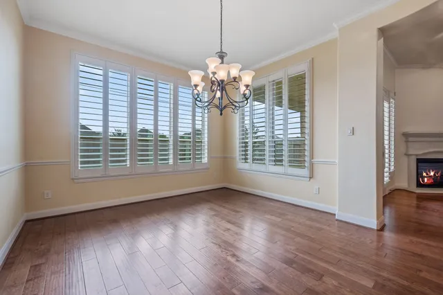 a view of livingroom with natural light and hardwood
