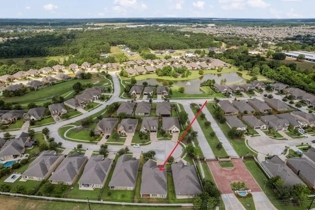 an aerial view of residential house with outdoor space and river