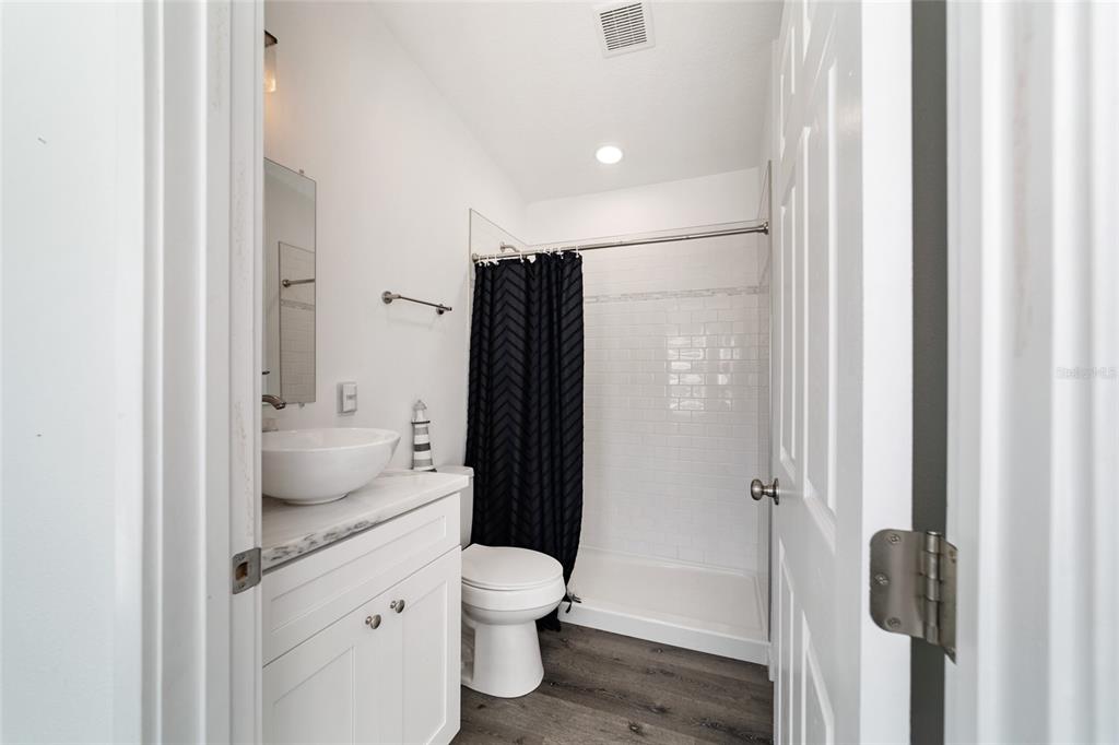 15991 Northeast 243rd Place Road, Unit 351 & 352 Fort McCoy, FL 32134 - Photo 20 of 86 a bathroom with a granite countertop sink toilet and shower