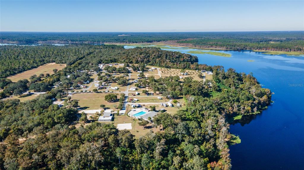 15991 Northeast 243rd Place Road, Unit 351 & 352 Fort McCoy, FL 32134 - Photo 2 of 86 an aerial view of a house with a lake view