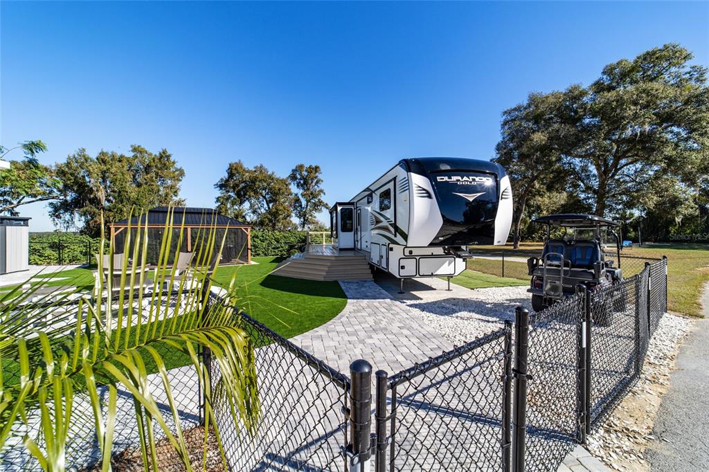 15991 Northeast 243rd Place Road, Unit 351 & 352 Fort McCoy, FL 32134 - Photo 27 of 86 a view of a swimming pool with a patio and a yard