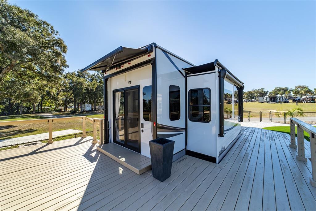 15991 Northeast 243rd Place Road, Unit 351 & 352 Fort McCoy, FL 32134 - Photo 31 of 86 a view of a house with barbeque and wooden floor