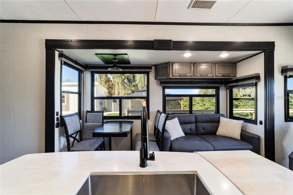 15991 Northeast 243rd Place Road, Unit 351 & 352 Fort McCoy, FL 32134 - Photo 35 of 86 a living room with furniture and a large window