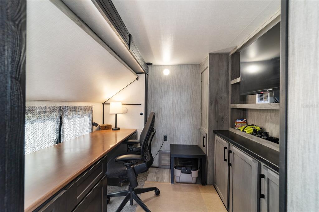 15991 Northeast 243rd Place Road, Unit 351 & 352 Fort McCoy, FL 32134 - Photo 39 of 86 a view of a hallway with workspace