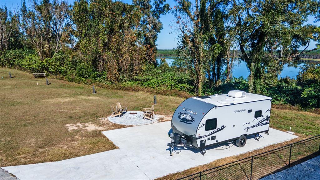 15991 Northeast 243rd Place Road, Unit 351 & 352 Fort McCoy, FL 32134 - Photo 54 of 86 a view of a small yard in front of the house with a yard
