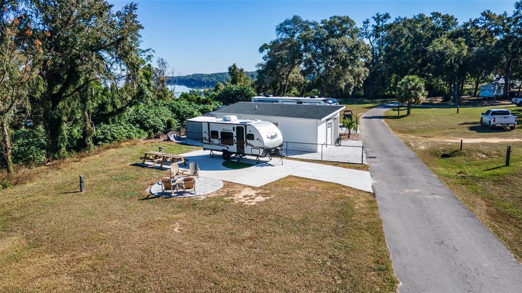 15991 Northeast 243rd Place Road, Unit 351 & 352 Fort McCoy, FL 32134 - Photo 55 of 86 a view of a swimming pool with lawn chairs