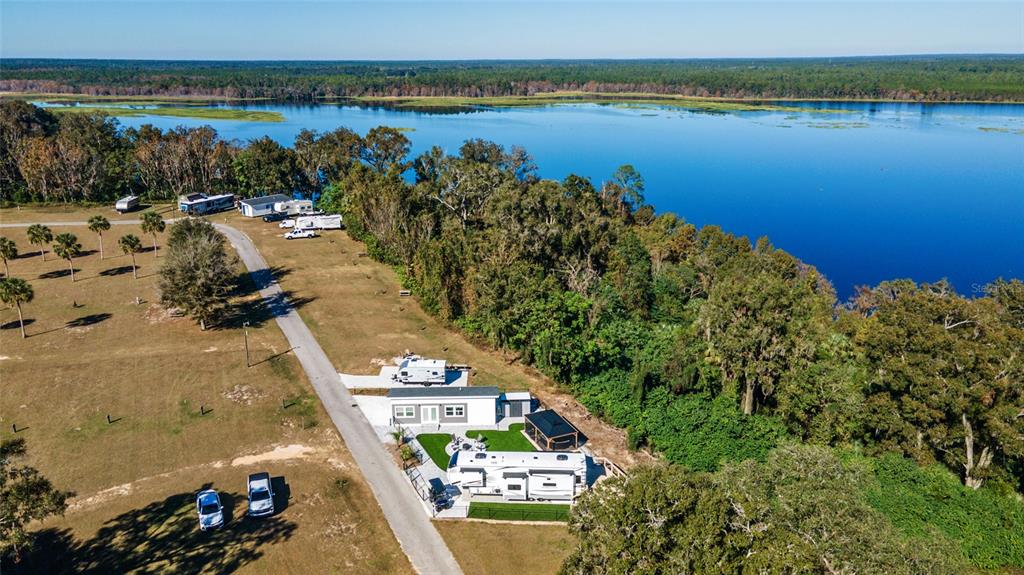 15991 Northeast 243rd Place Road, Unit 351 & 352 Fort McCoy, FL 32134 - Photo 76 of 86 an aerial view of a house with a lake view