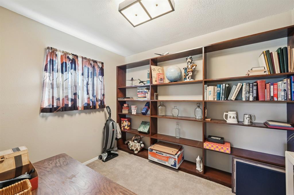 840 Ridge Drive Bedford, TX 76021 - Photo 16 of 40 The office which is upstairs with lots of built in bookshelves.