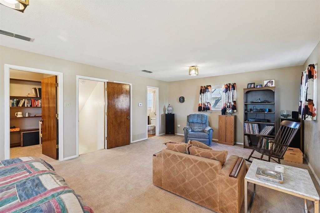 840 Ridge Drive Bedford, TX 76021 - Photo 18 of 40 The game room located upstairs. There is a walk in closet in this room.
