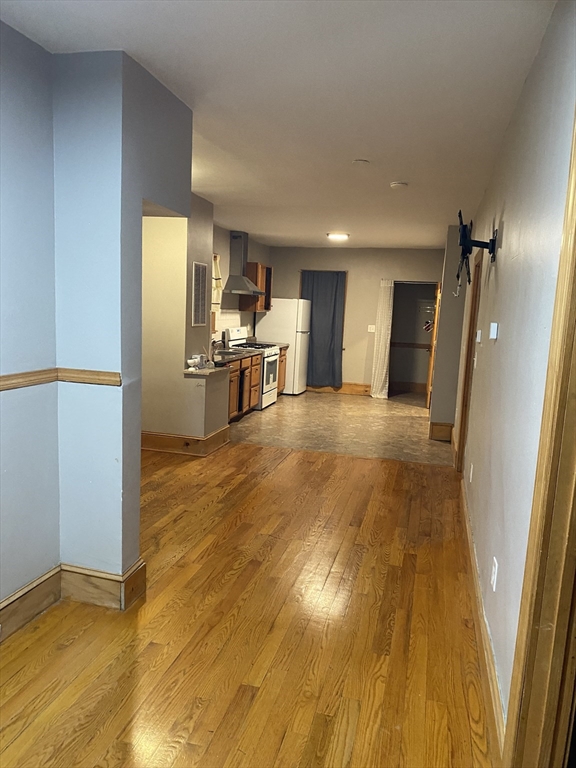 26 Wendover Street, Unit 1 Boston, MA 02125 - Photo 1 of 1 a view of a kitchen with furniture and wooden floor