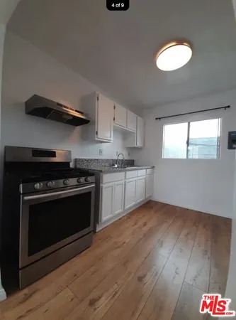 a kitchen with a stove and a microwave