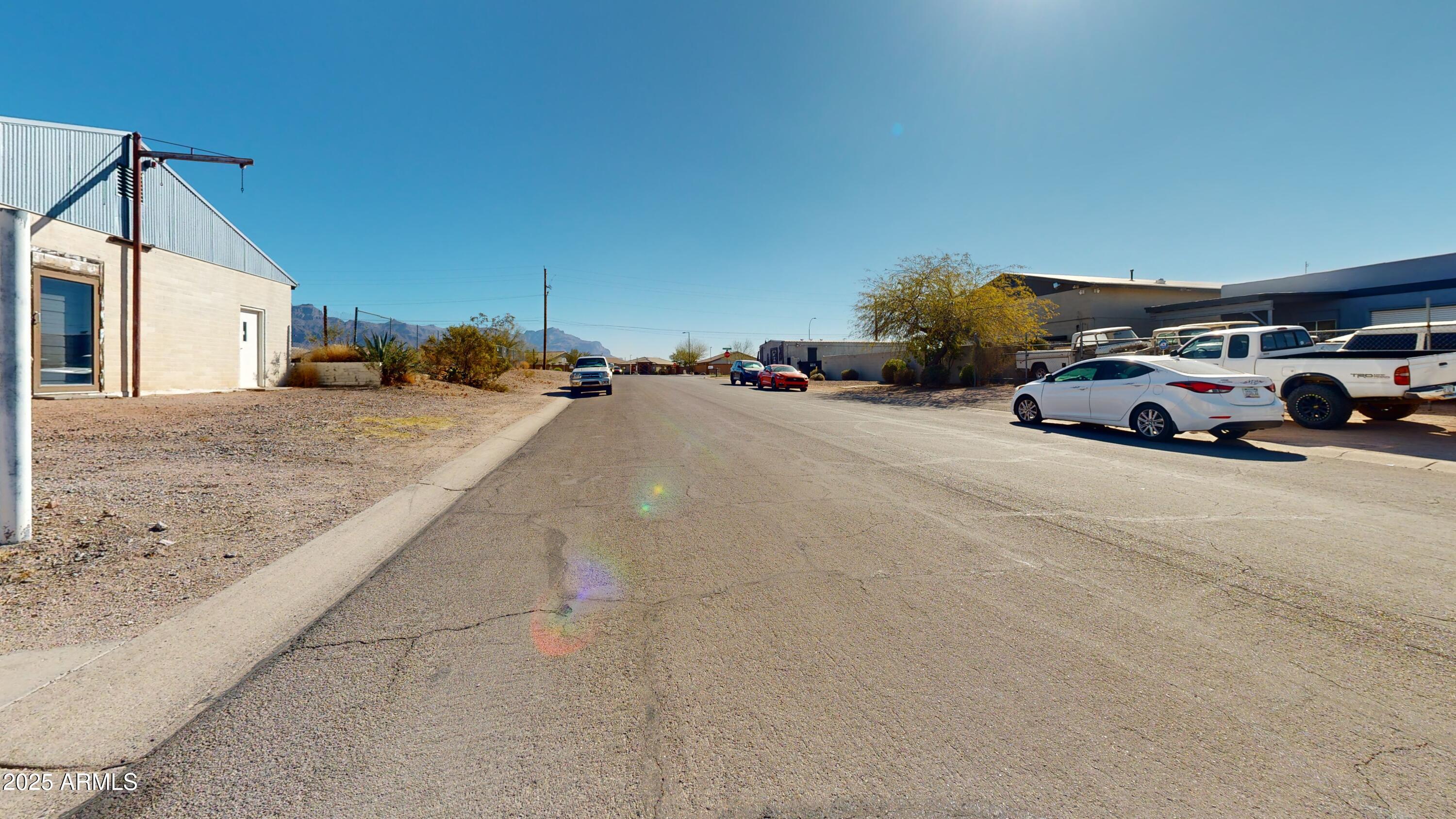 1474 East 18th Avenue, Unit 33 Apache Junction, AZ 85119 - Photo 3 of 5 a view of a cars parked in front of a house