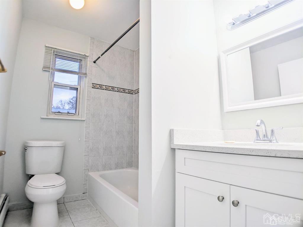 B Alva Court Edison, NJ 08817 - Photo 12 of 17 a bathroom with a sink a toilet and shower