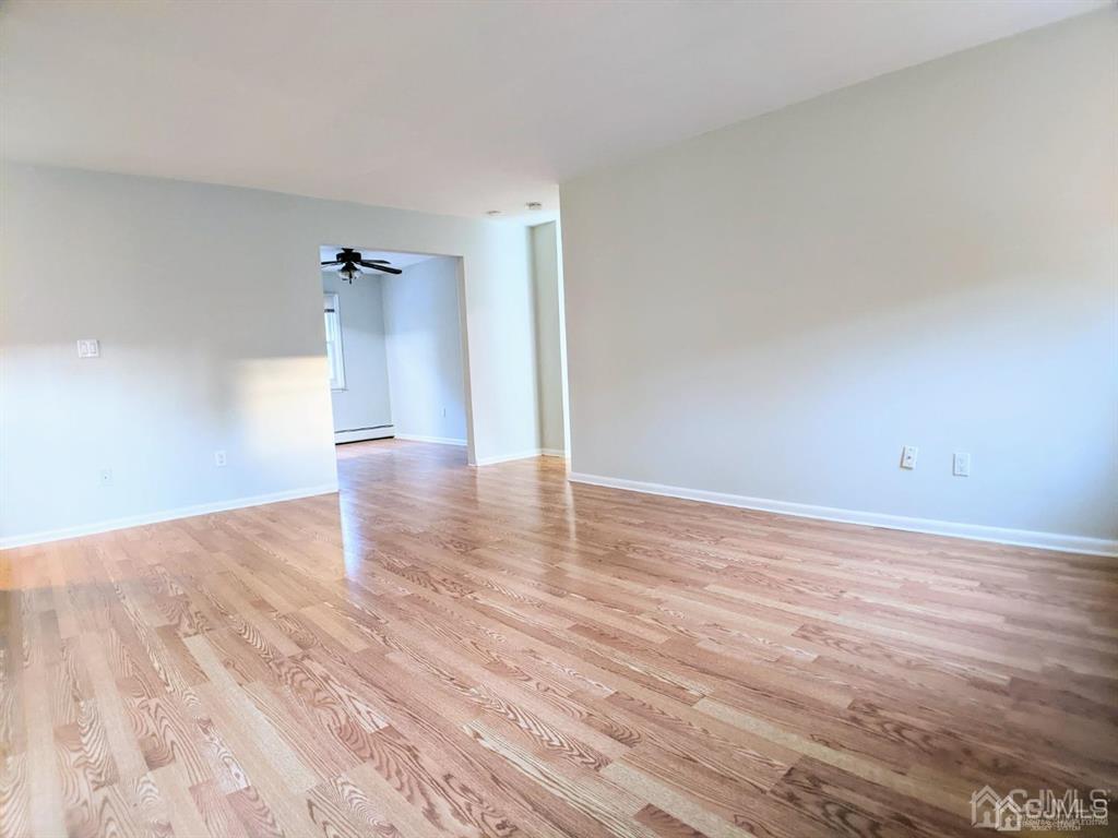 B Alva Court Edison, NJ 08817 - Photo 4 of 17 a view of empty room with wooden floor