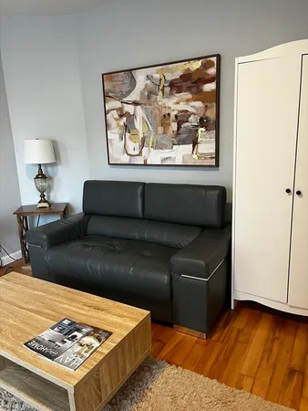 a living room with furniture and a rug