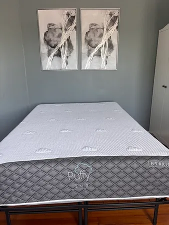 a living room with a couch and a rug