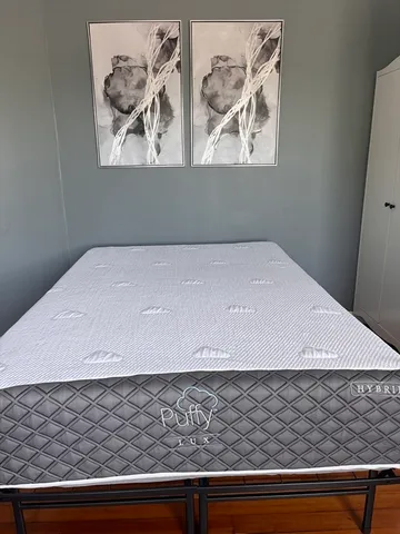 a living room with a couch and a rug