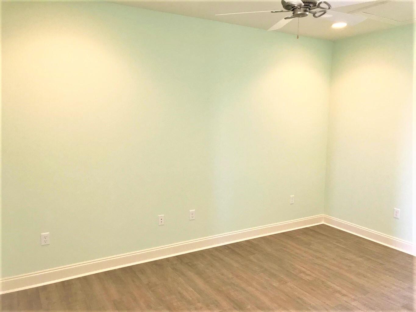 148 Chapman Street Santa Rosa Beach, FL 32459 - Photo 11 of 23 a view of a small space with wooden floor and a window